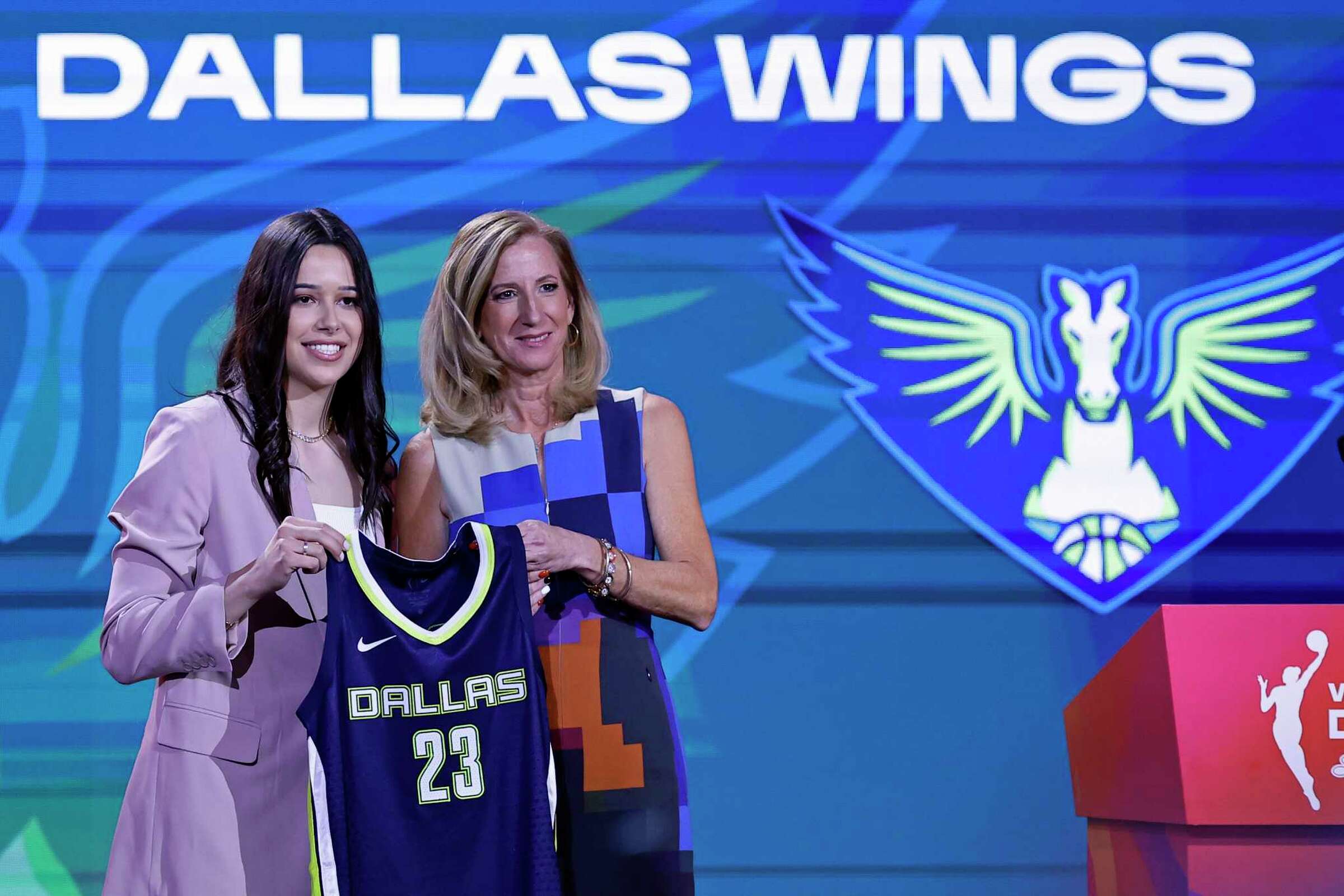 Lou Lopez Senechal poses for a photo with commissioner Cathy Engelbert after being selected by the Dallas Wings at the WNBA draft